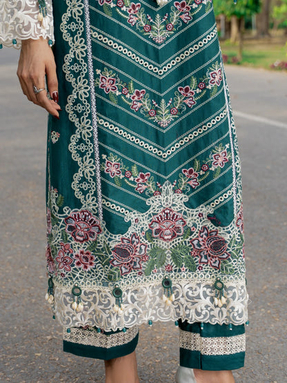 Traditional embroidered garment with intricate patterns on a blurred outdoor background